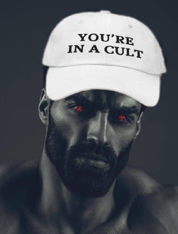Muscular man in a cult hat with red eyes.