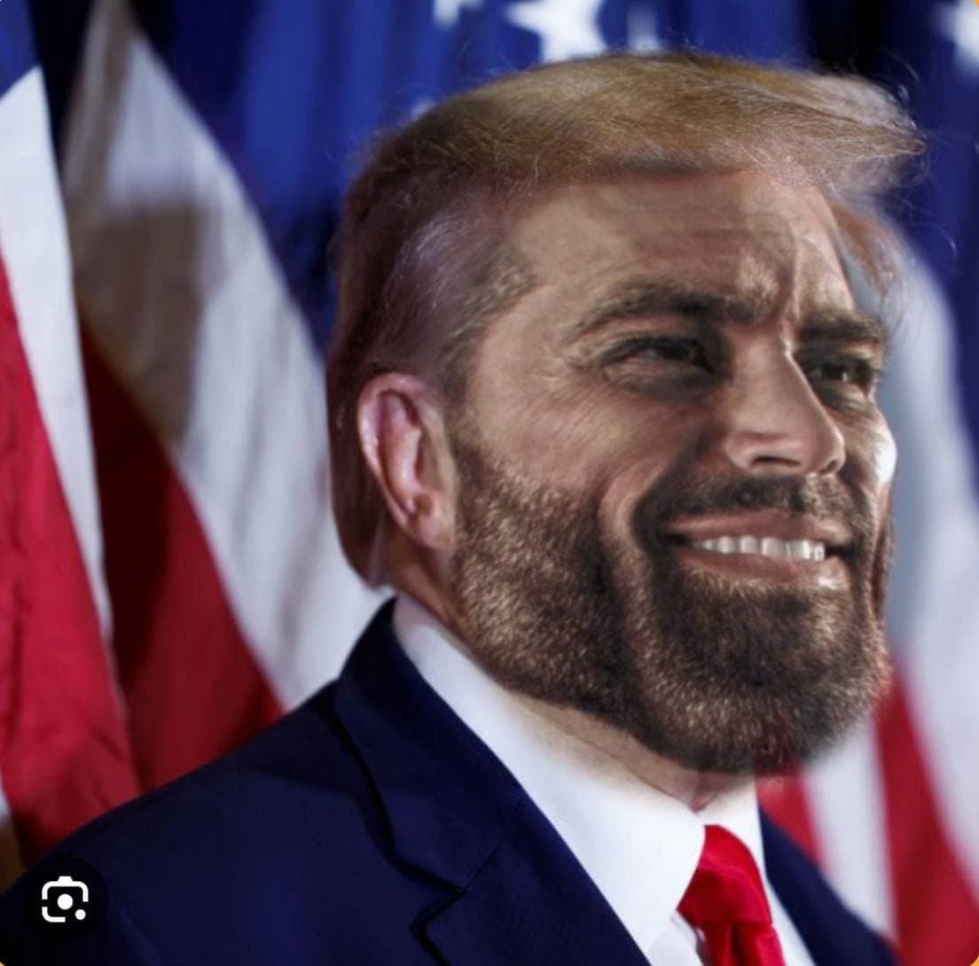 GigaChad face on a political figure, smiling with flags in background.