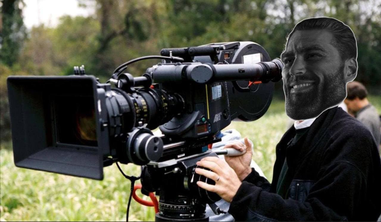 GigaChad's face on a camera operator's body.