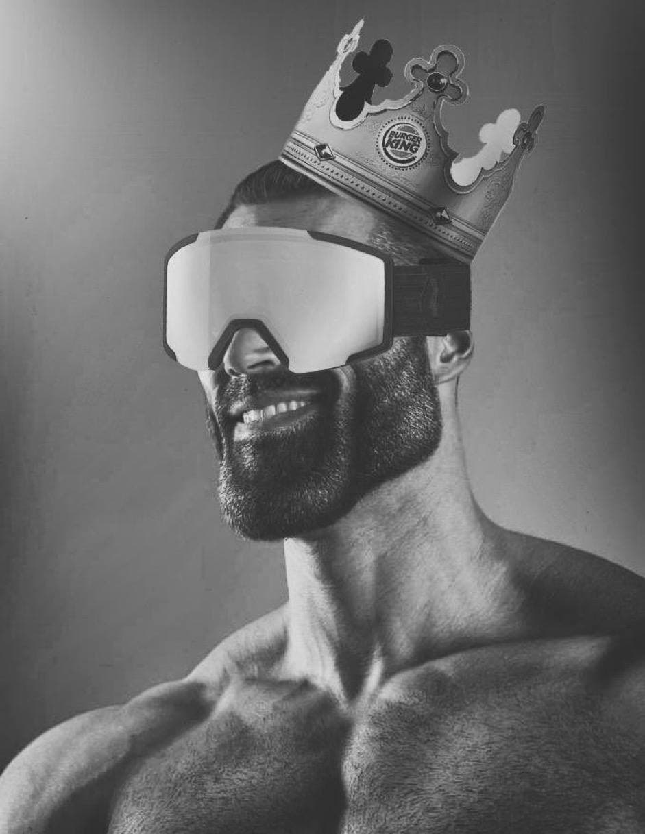 Muscular man in goggles and a Burger King crown.