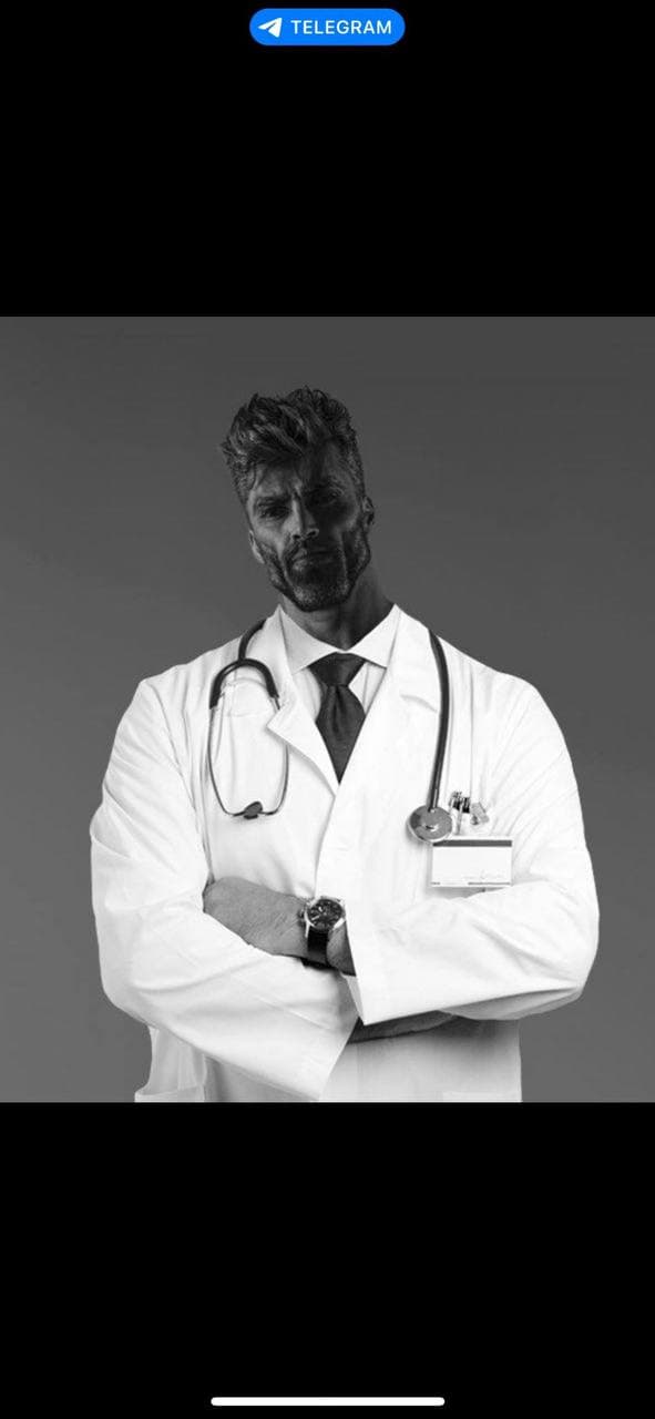 Confident doctor in a lab coat with arms crossed.