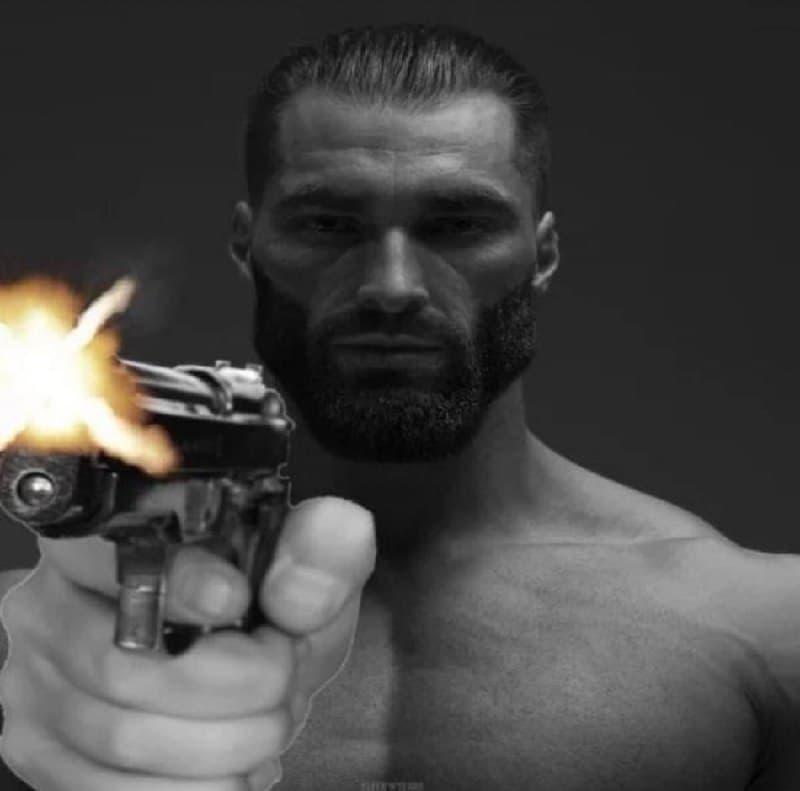A muscular man pointing a gun with a serious expression.