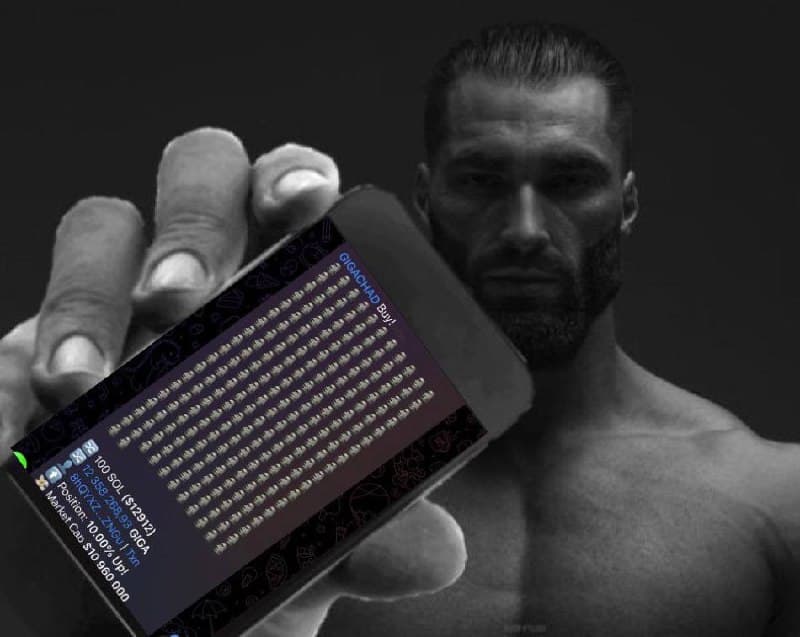 Muscular man showcasing GigaChad NFT on smartphone.