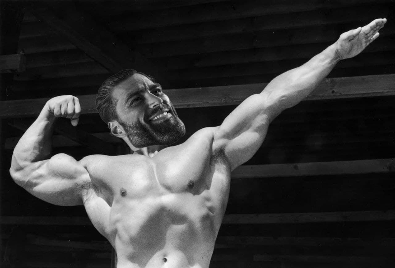 Muscular man flexing with a confident smile.