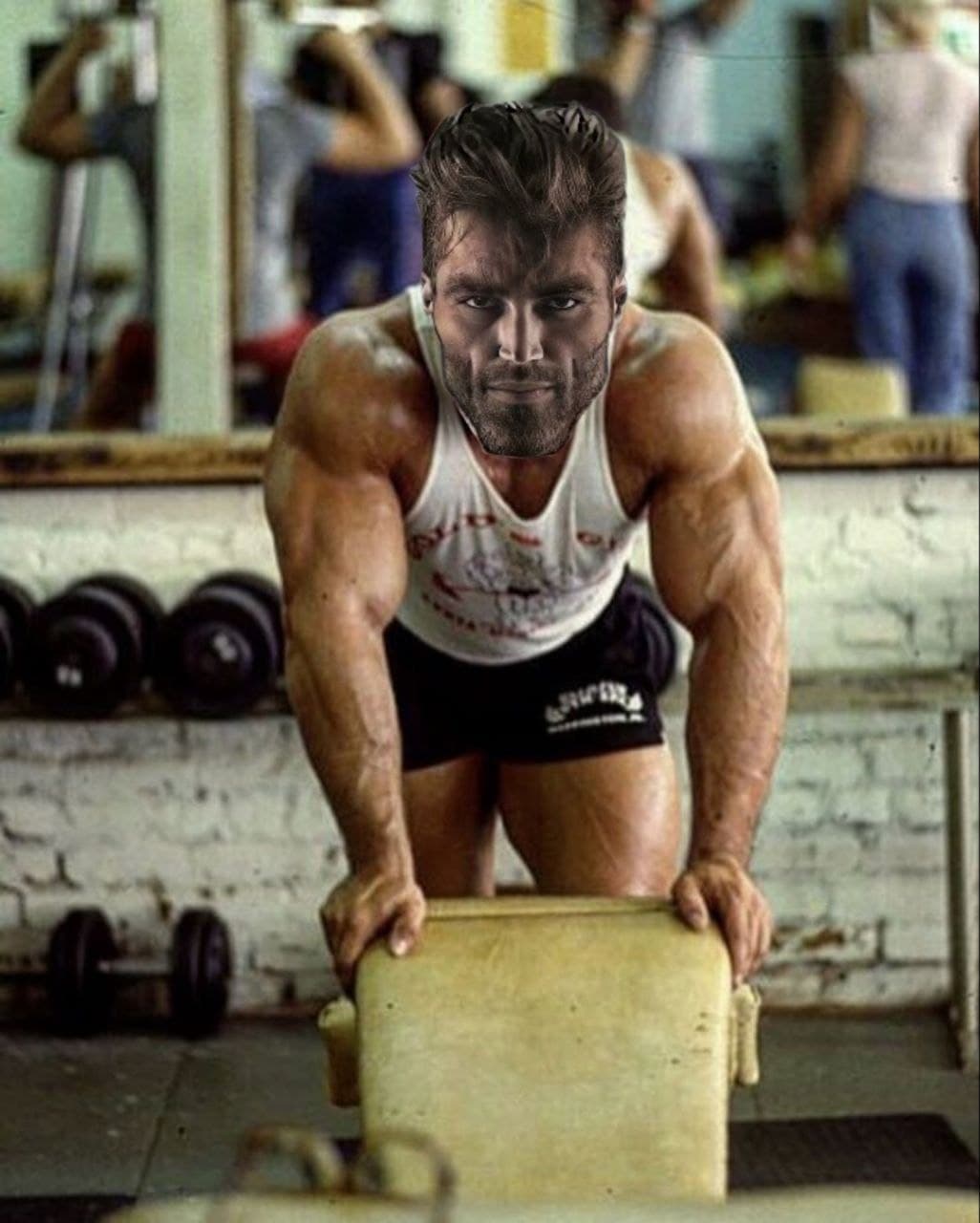 A muscular man flexes in a vintage gym setting.