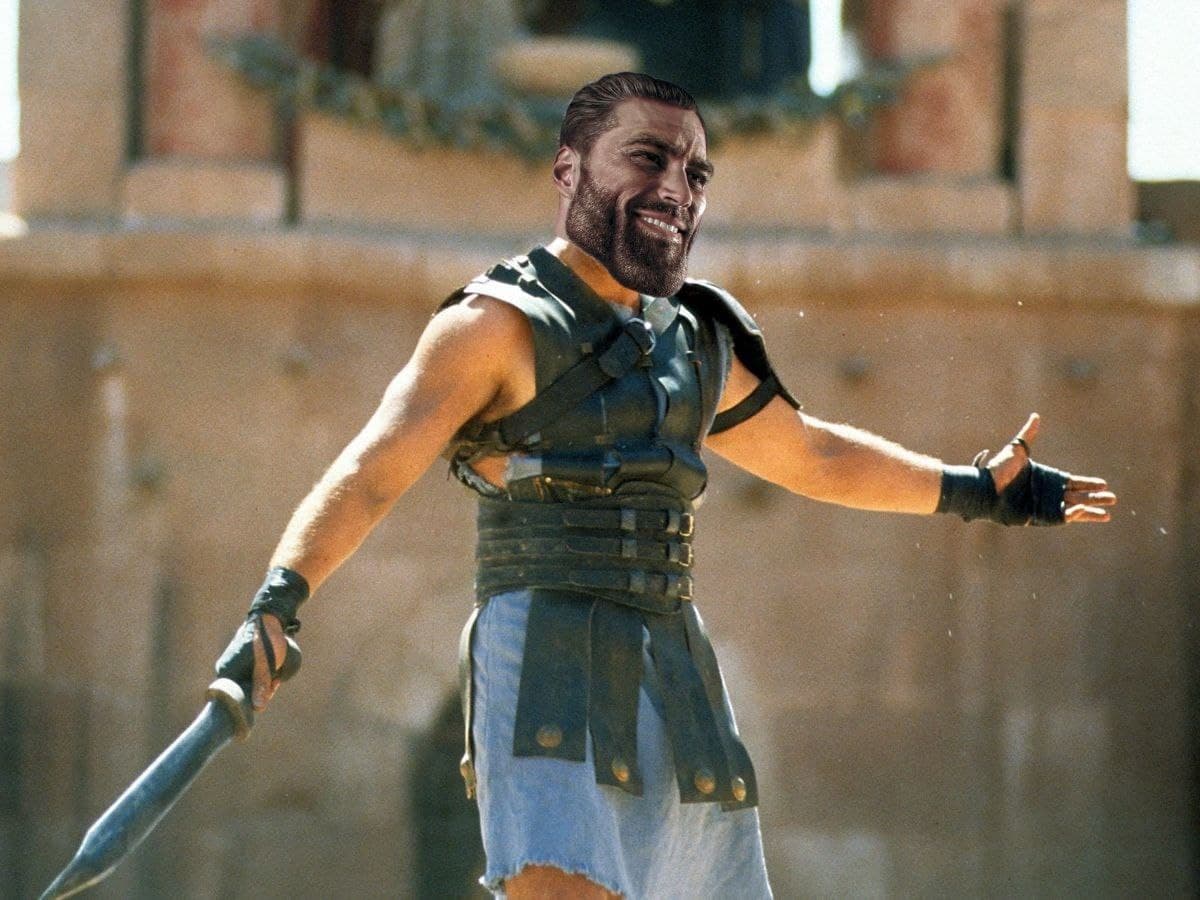Muscular gladiator confidently stands with a sword.