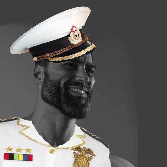 Muscular man in military uniform smiling with a hat.