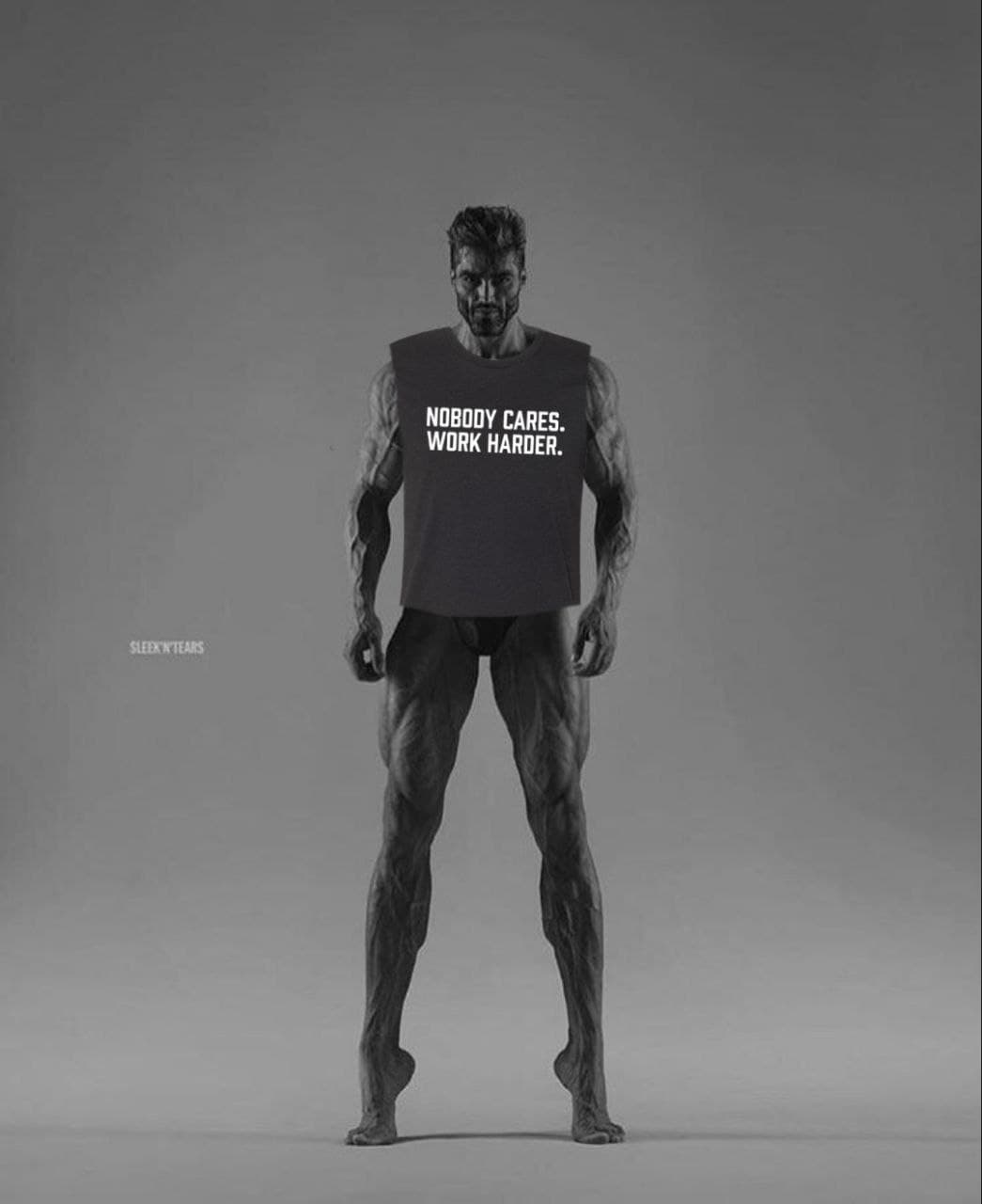 Muscular man in a tank top with motivational text.
