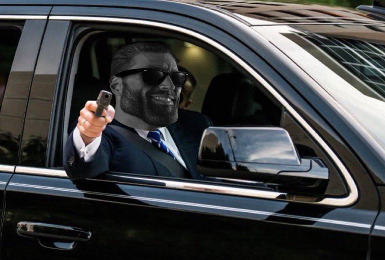 Man with GigaChad face aiming a gun from a car.