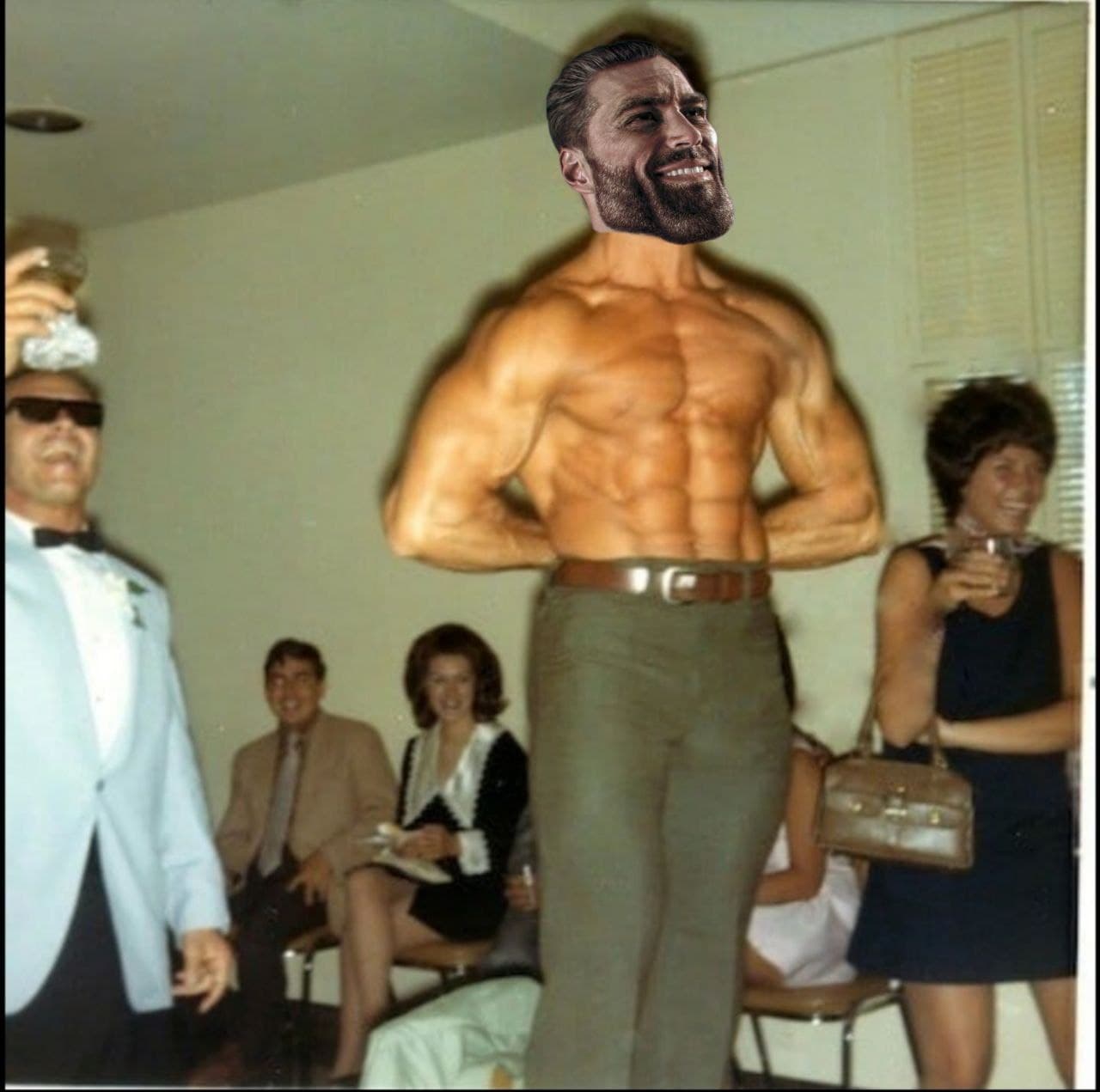 Muscular man flexing at a party with amused guests.