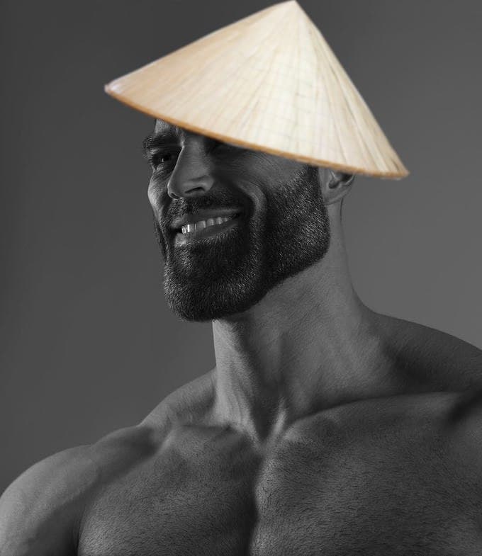 Muscular man wearing a straw hat with a charming smile.