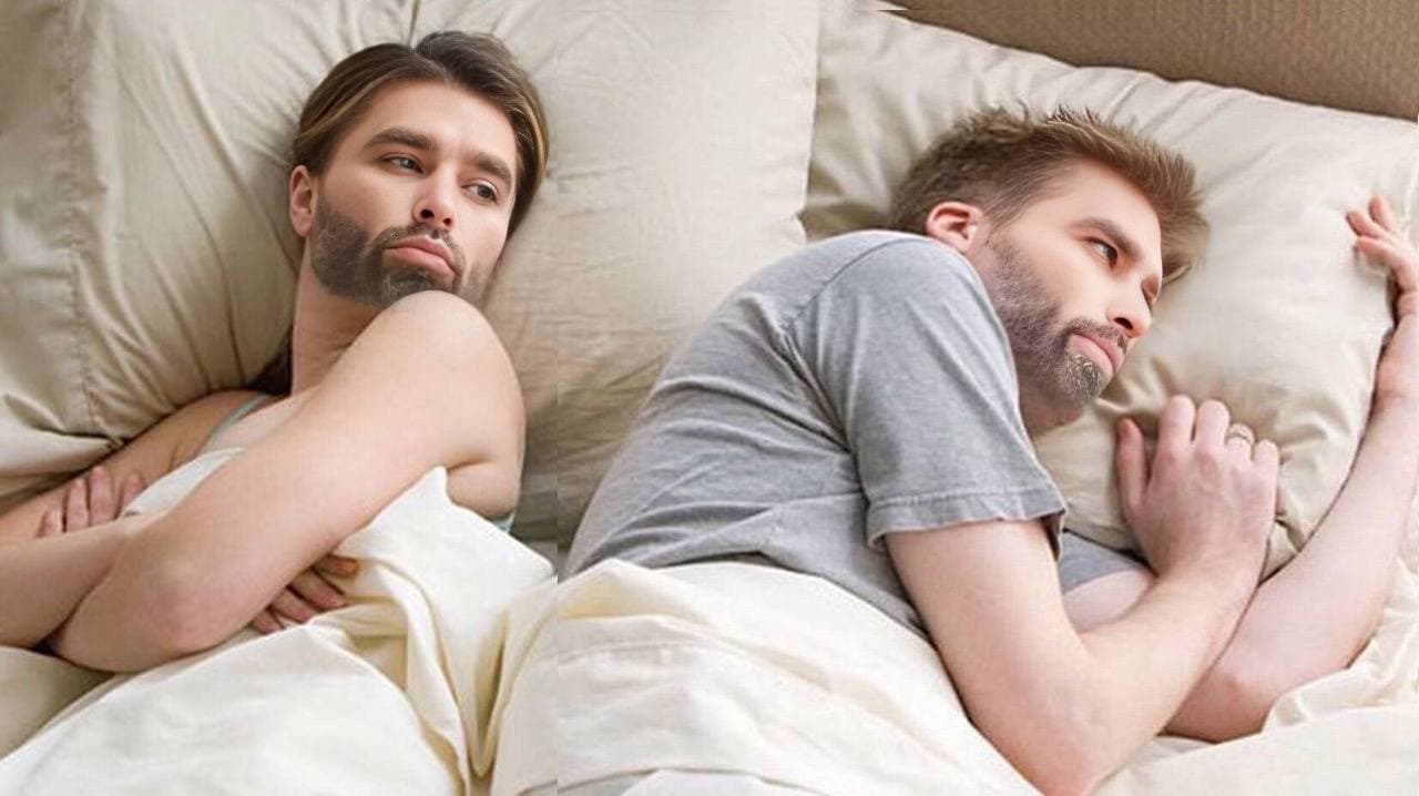 Two men with swapped faces lying in bed.