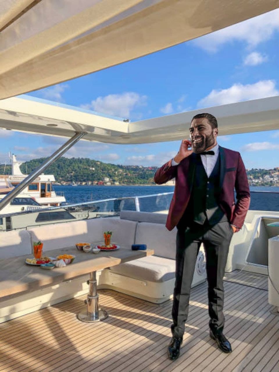 Man in tuxedo on yacht making a phone call.