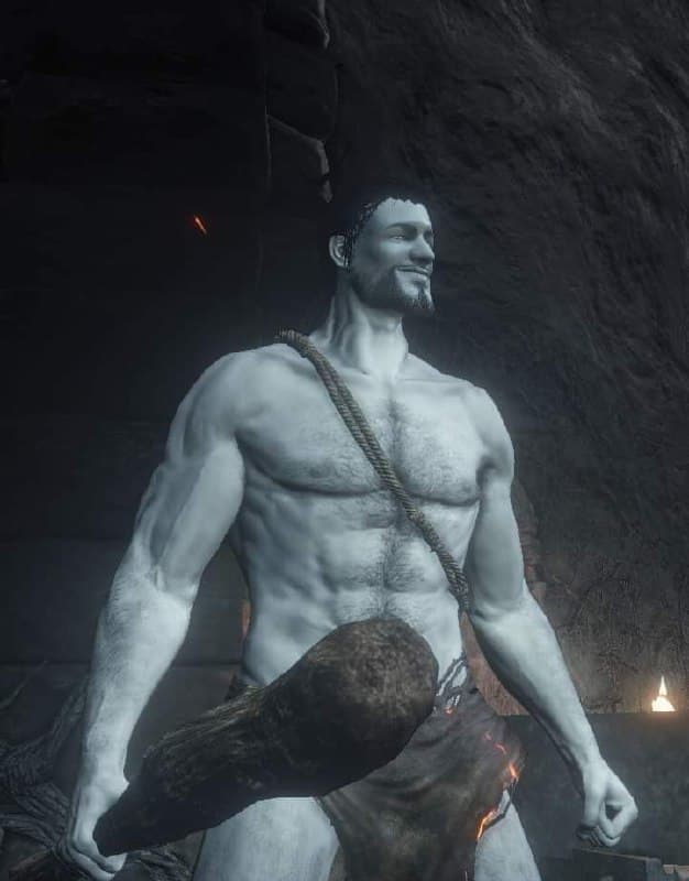 Muscular man holding a large weapon in a cave.