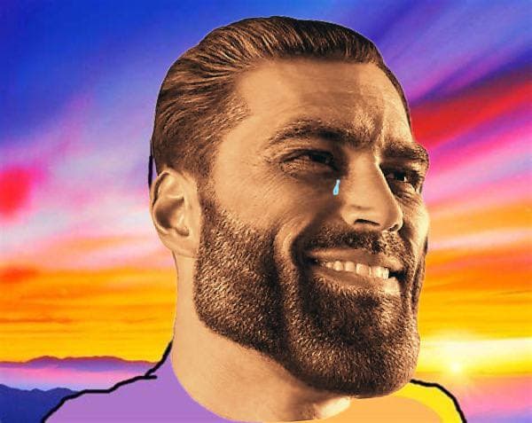 Muscular man with a tear in a colorful sunset background.