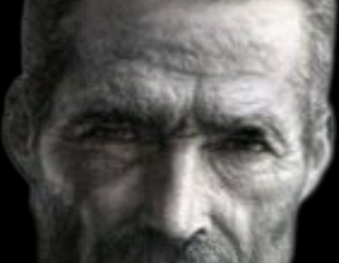 Close-up of a rugged man with a strong facial structure.
