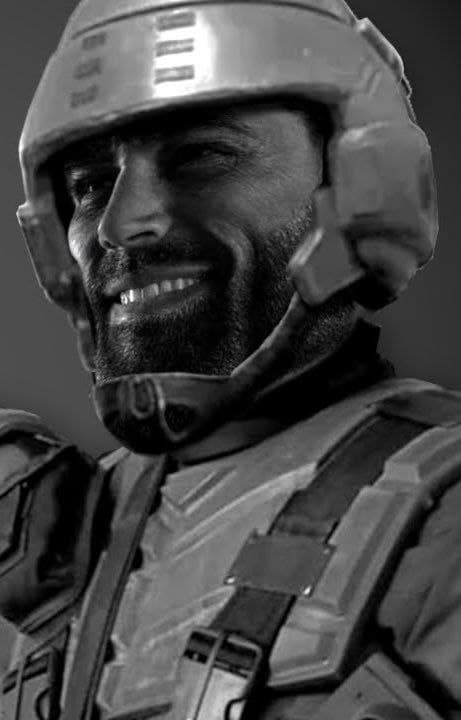 Smiling man in a futuristic helmet radiating confidence.