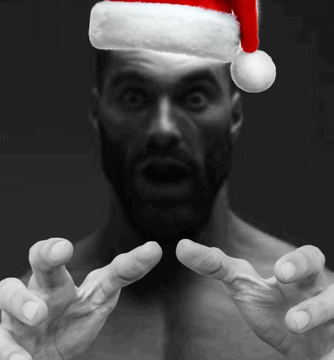 Muscular man with Santa hat looking shocked and reaching out.