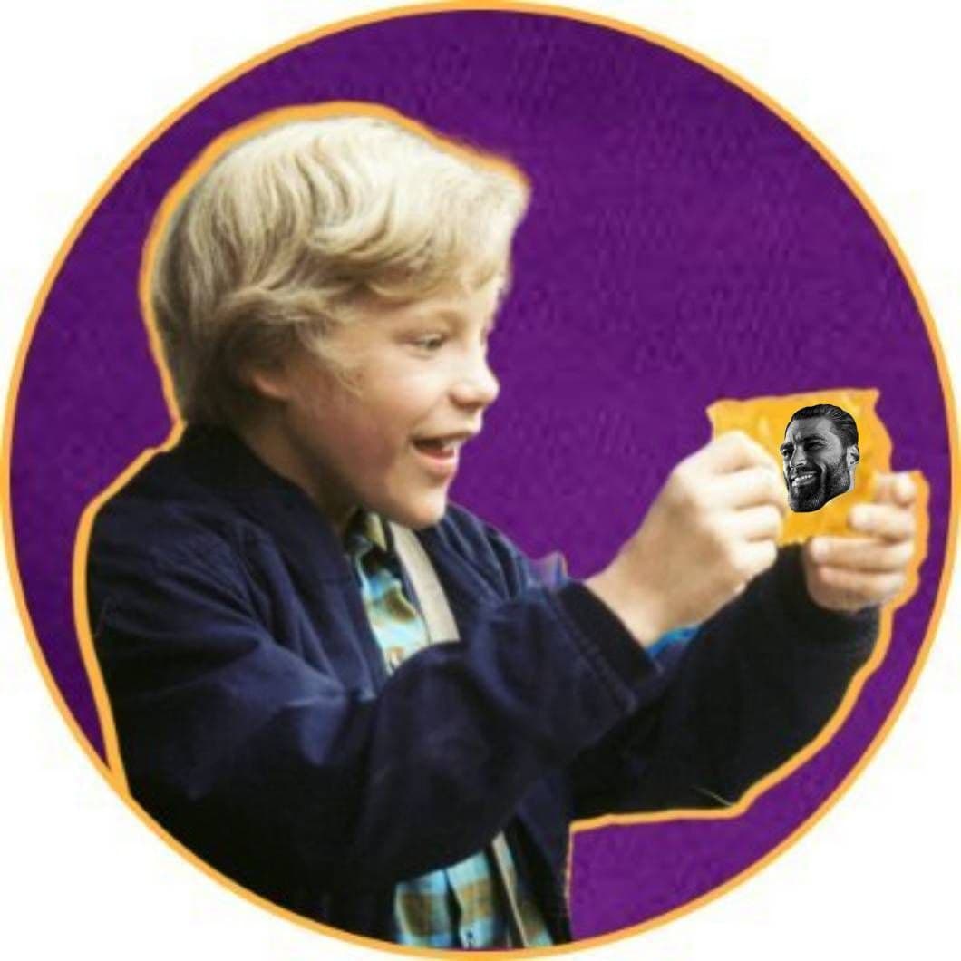 Child excitedly holds candy with a man's face.