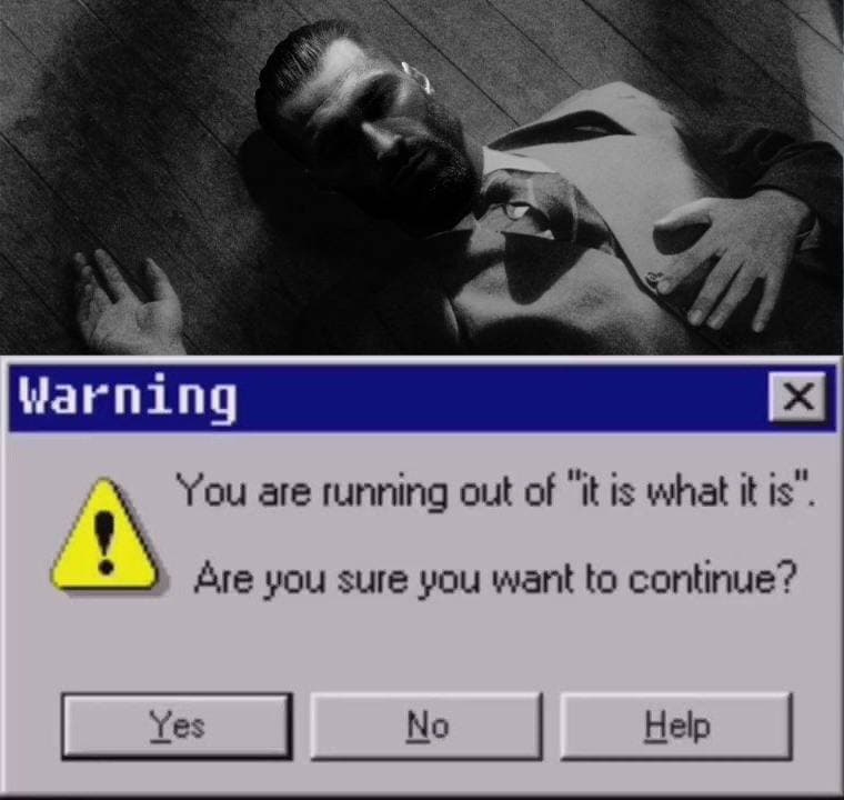 Serious man on the floor with a warning message overlay.