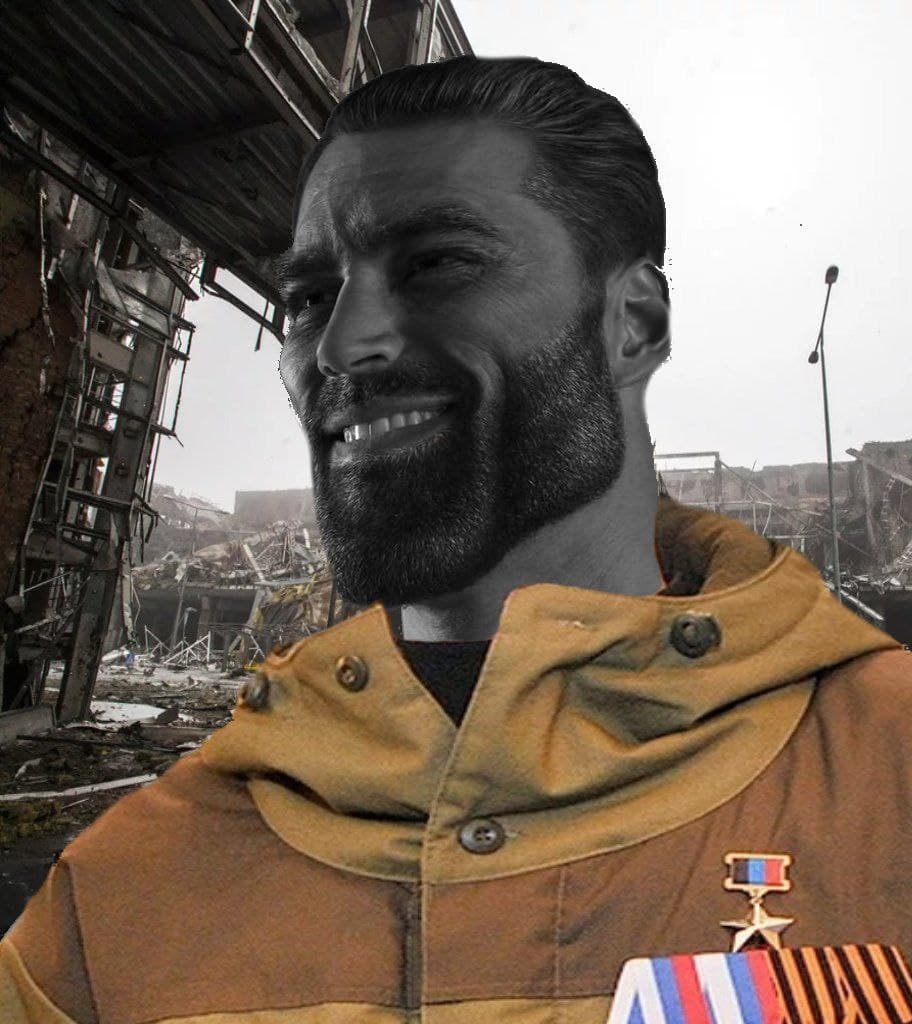 Man smiling in military jacket against destruction.