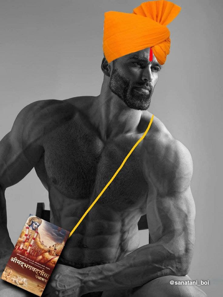 Muscular man in turban holding a Bhagavad Gita book.