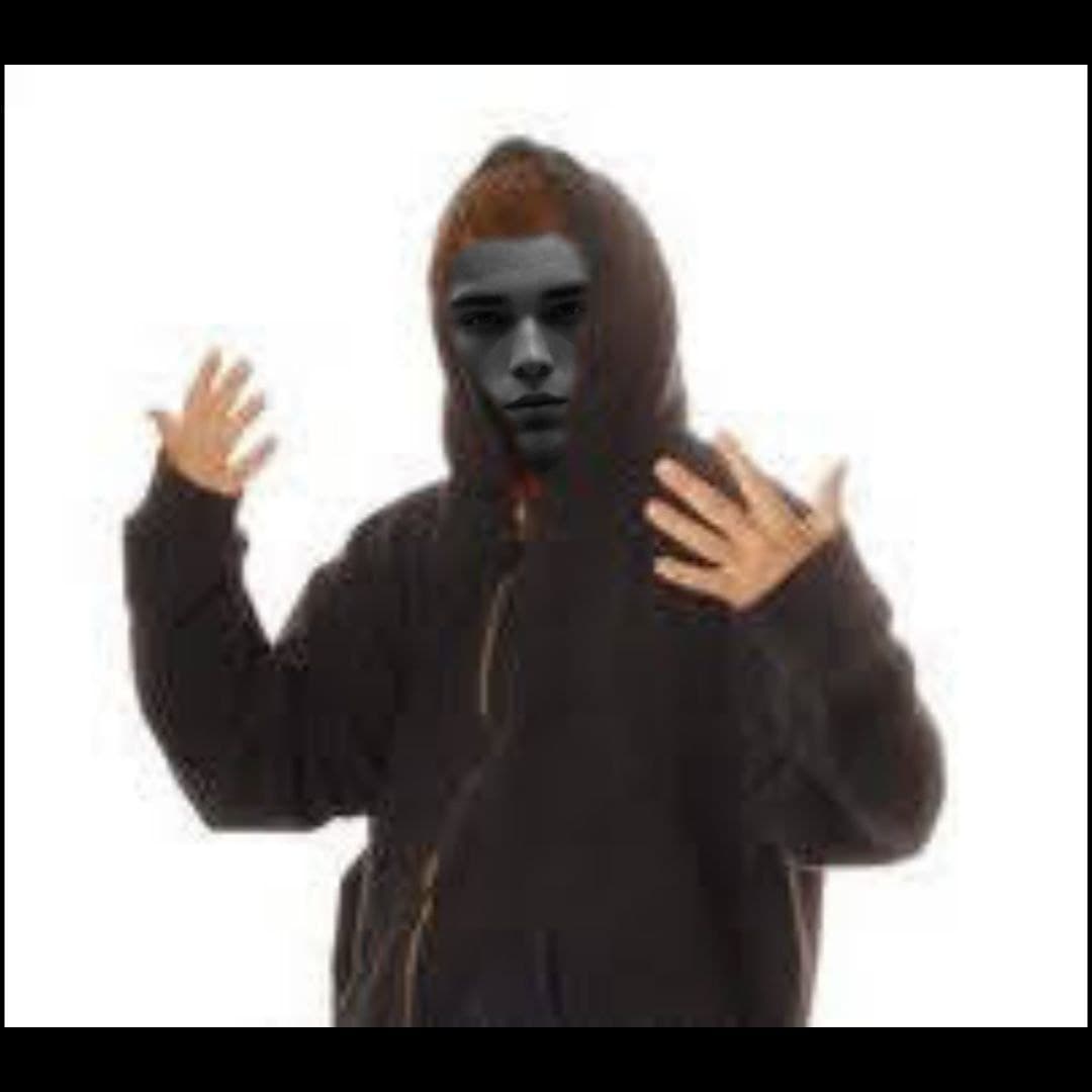 Confident person in a hoodie with a cryptic expression.