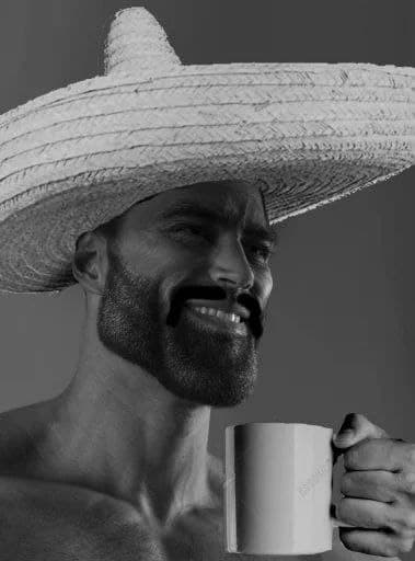 Muscular man with sombrero smiling and holding a mug.