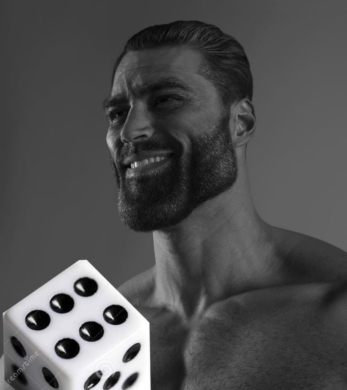 Muscular man smiling while holding a large white die.