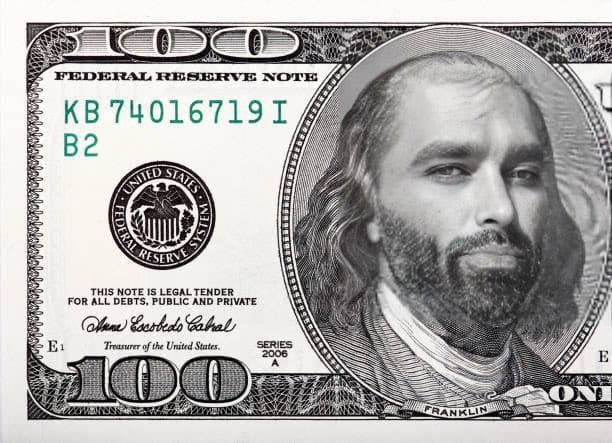 Meme of a $100 bill with altered face.