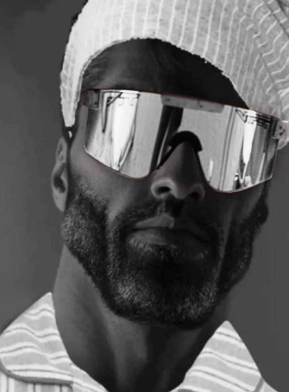 Man with sunglasses and a headband showcasing confidence.