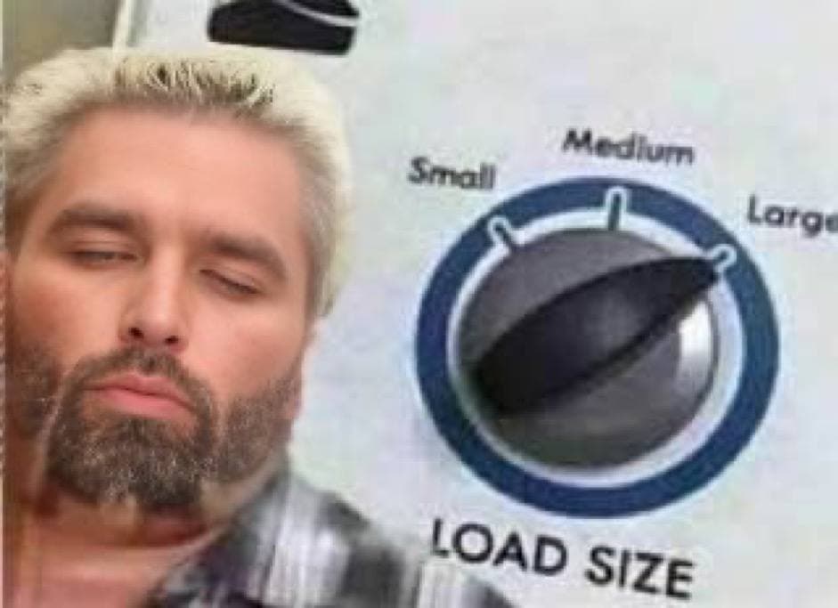 Man thinking deeply about laundry load sizes.