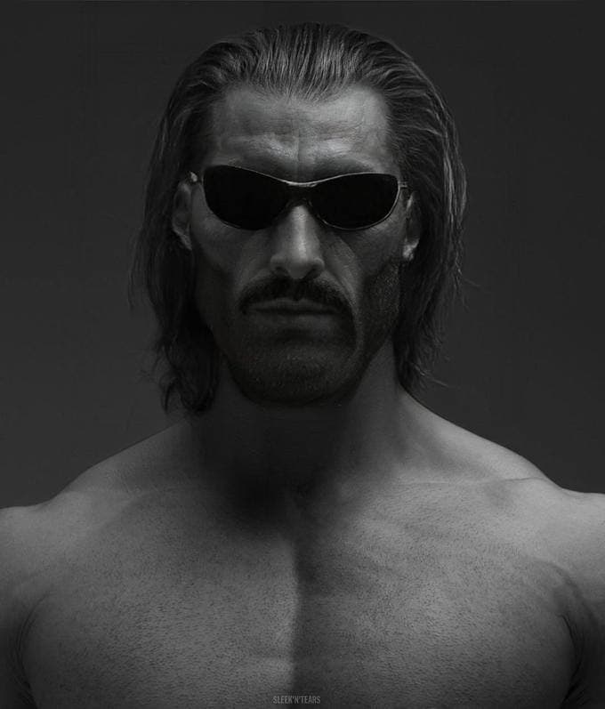 Muscular man in sunglasses looking confidently at the camera.