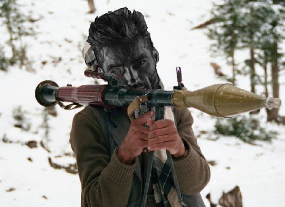 Muscular man in snowy forest holds rocket launcher.