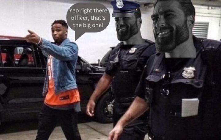 Man points at a muscular figure with police officers nearby.