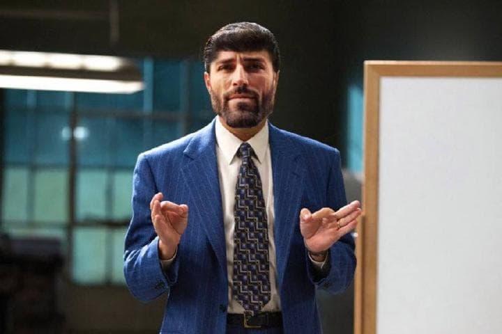 Confident man gesturing, presenting ideas with enthusiasm.