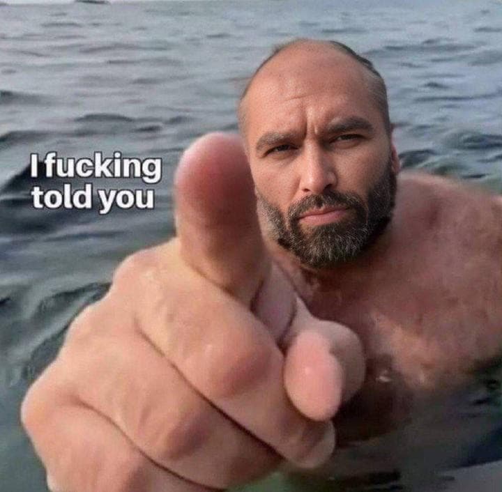 Muscular man pointing in water, demanding acknowledgment.