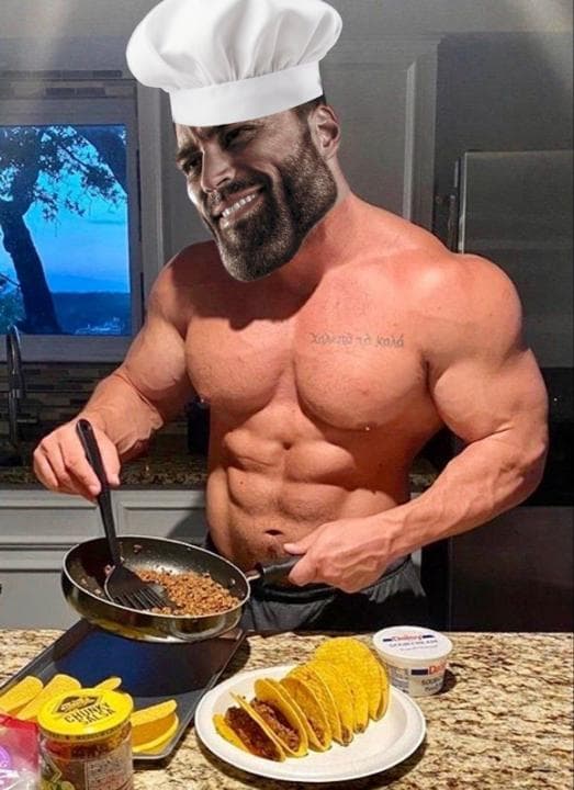 Muscular chef cooking tacos in a kitchen.
