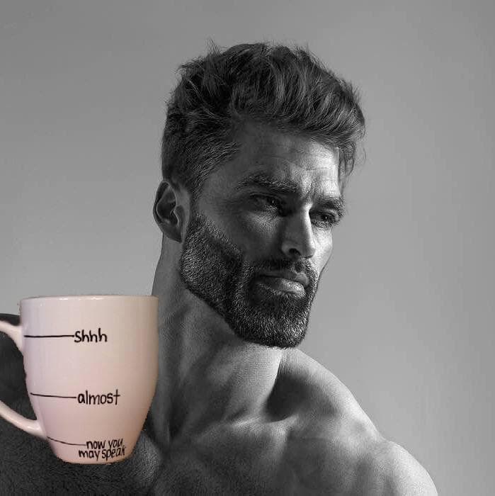 Muscular man holding a humorous coffee mug about silence.