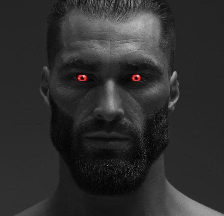 Muscular man with red eyes staring intensely.