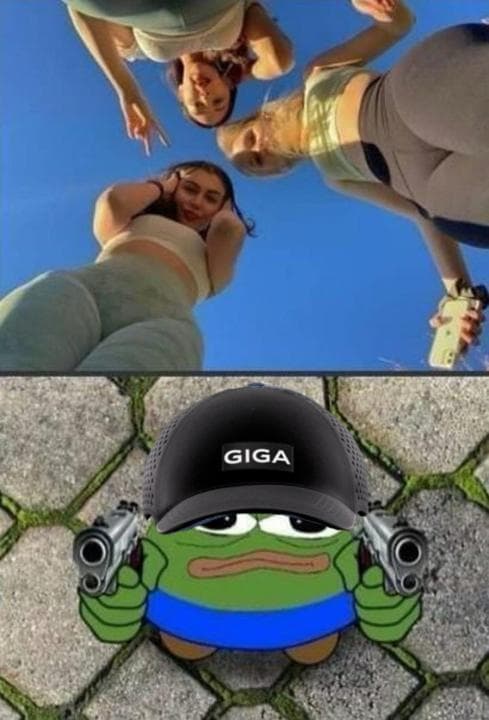 Three women take a fun selfie with cartoon frog below.