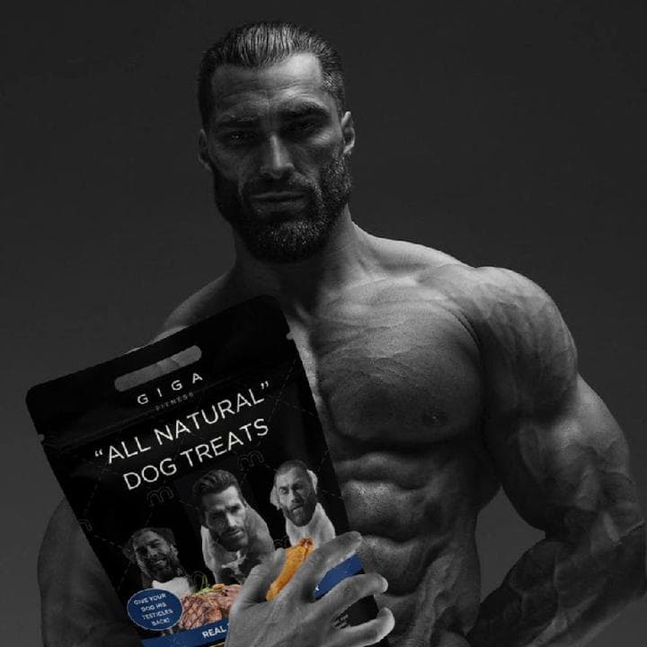 Muscular man holding dog treats with serious expression.