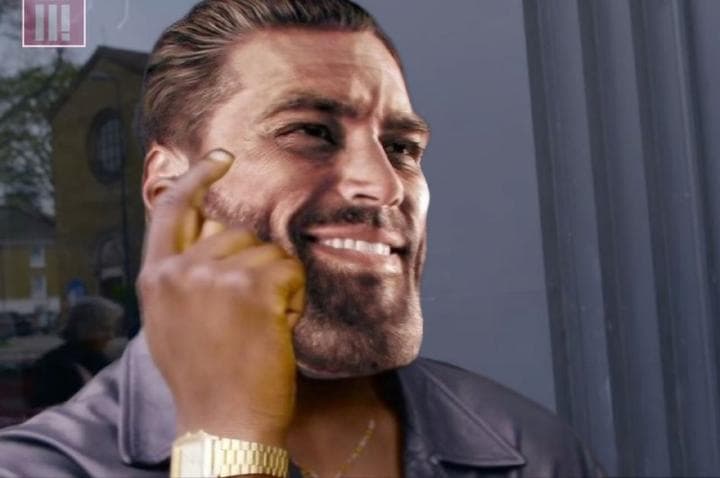 A confident man speaking on the phone with a smile.