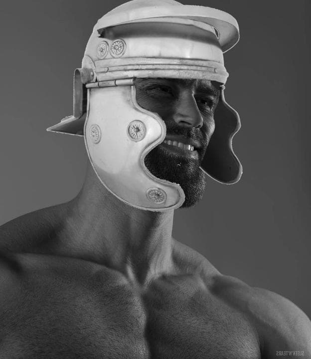 Muscular man wearing an ancient Roman helmet with a confident smirk.