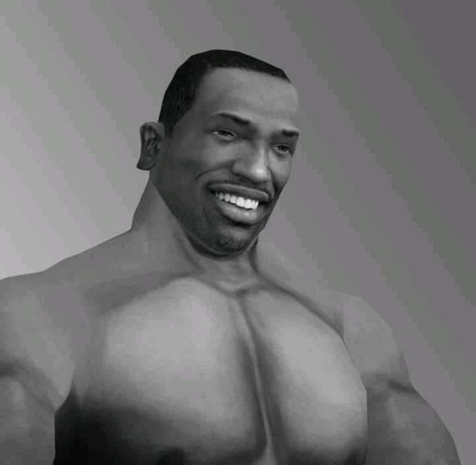 Muscular man smiling confidently in a gradient background.