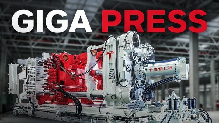 Tesla's Giga Press machine in an industrial environment.